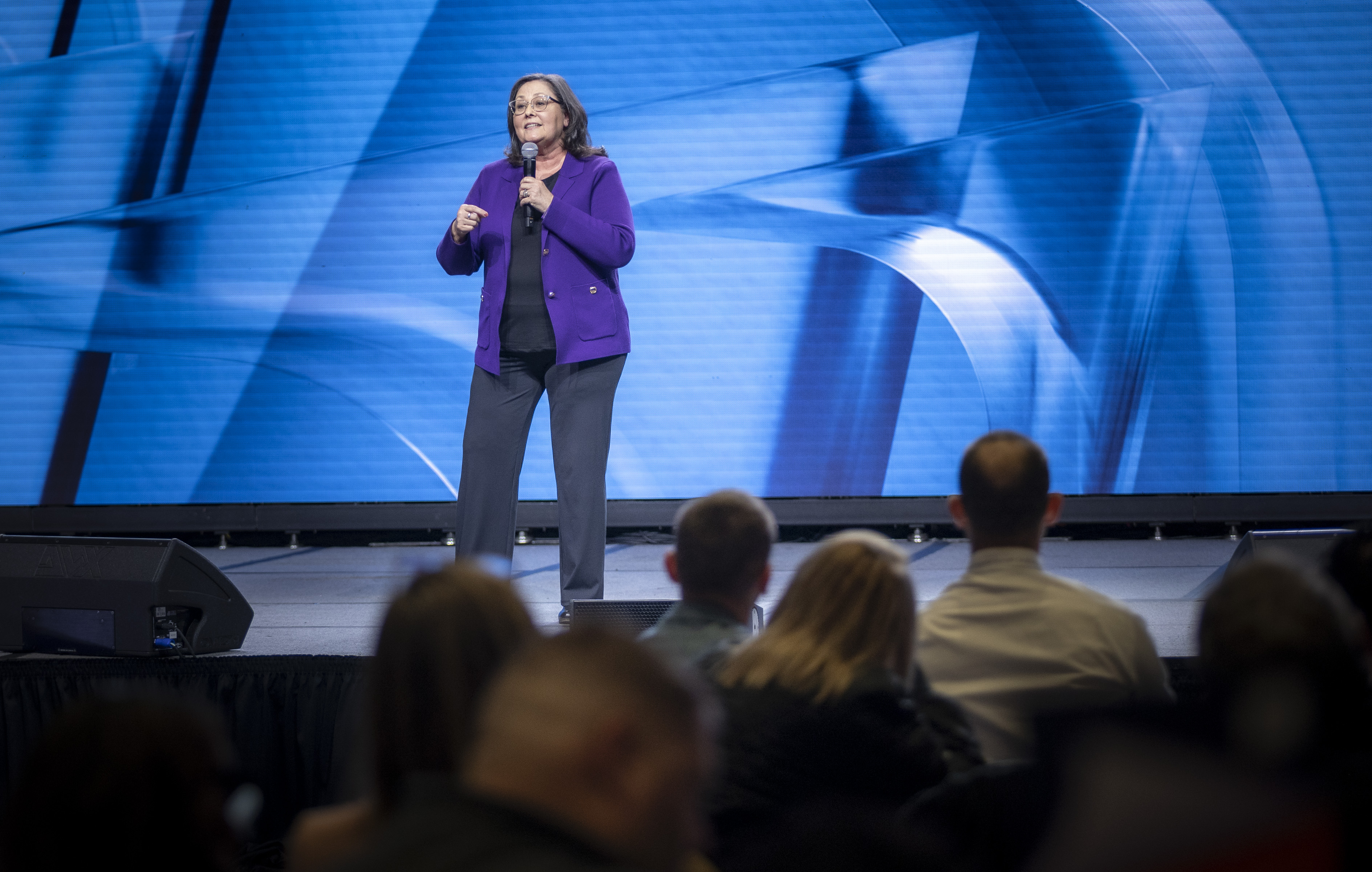 Michelle 'MO' Odom speaking on stage — Leadership Experience Strategist and International Speaker